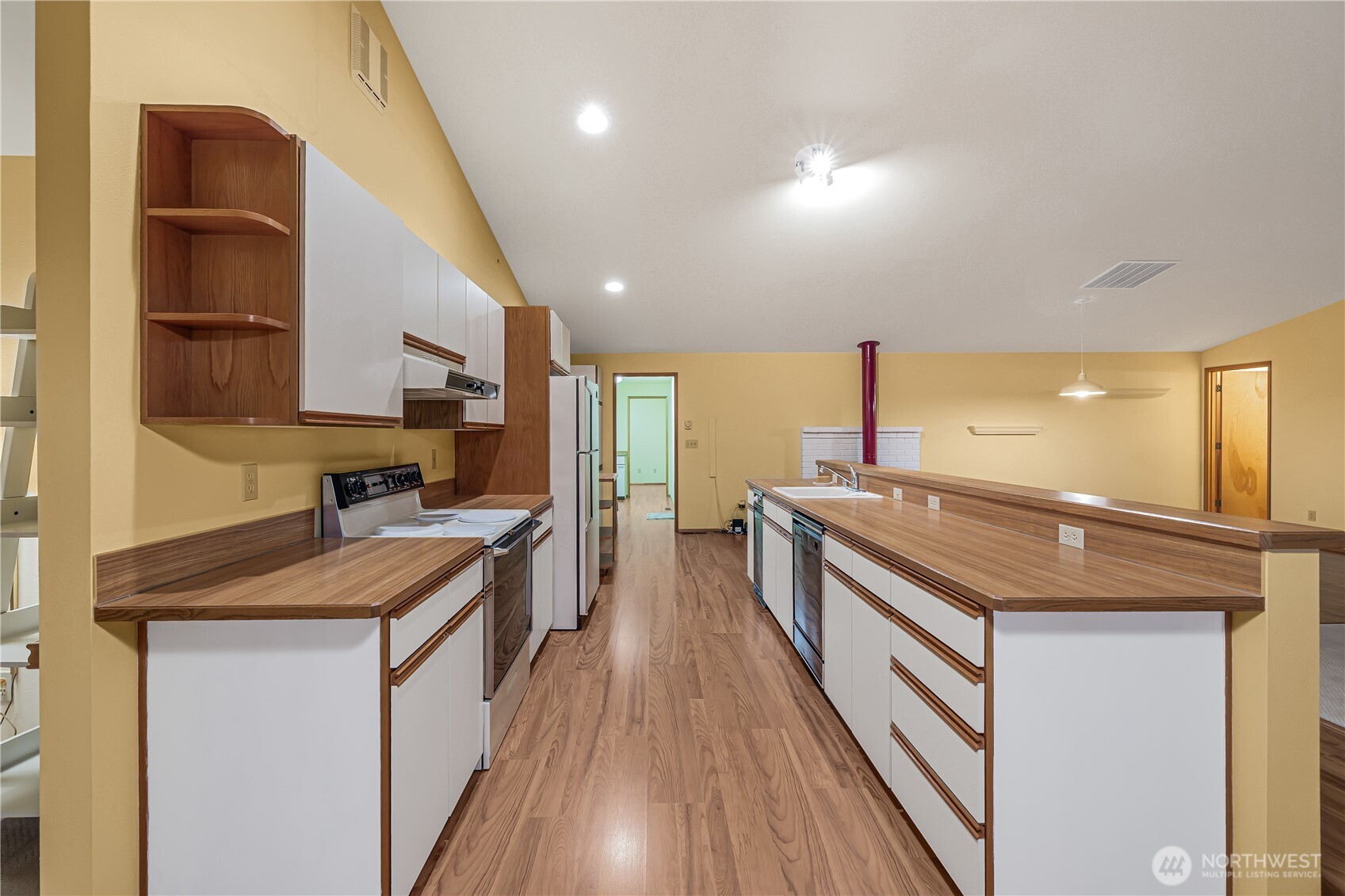5161 Red Bridge Road Cle Elum, WA 98922 - Photo 23 of 40 a kitchen with stainless steel appliances granite countertop wooden cabinets a stove top oven a sink and dishwasher