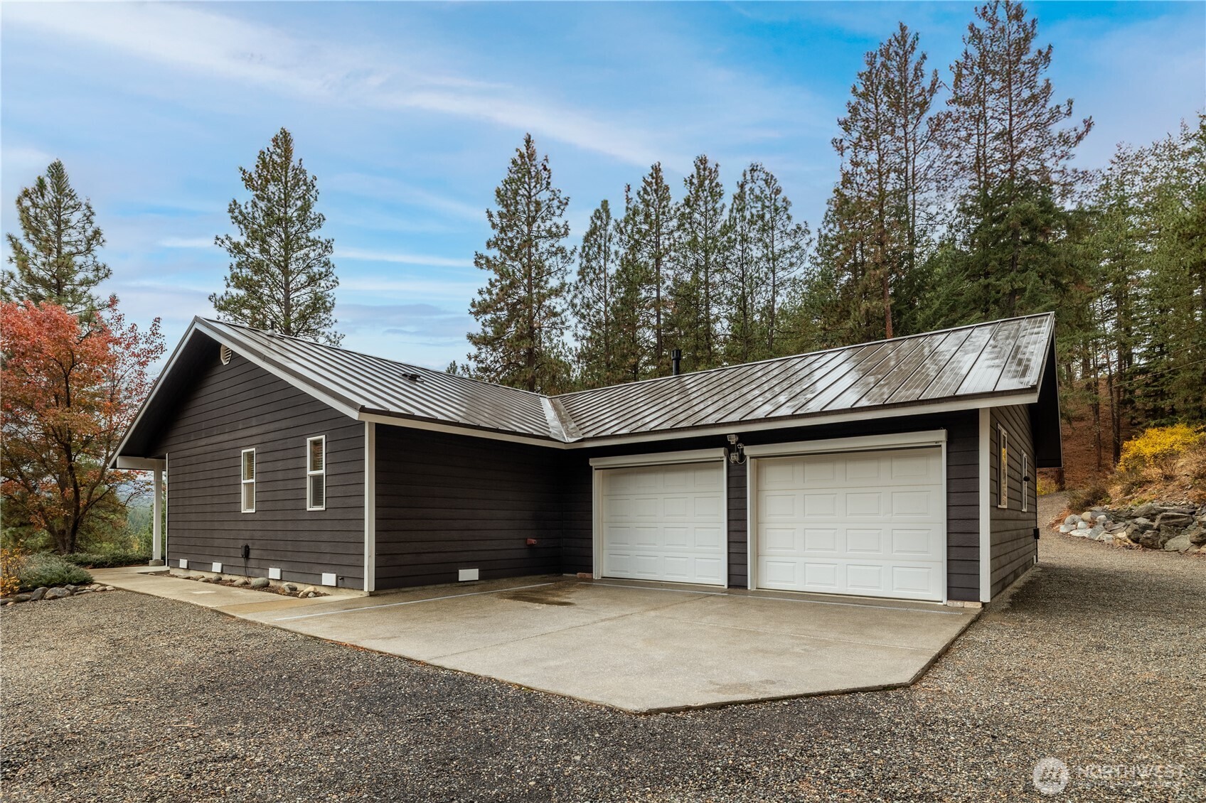 5161 Red Bridge Road Cle Elum, WA 98922 - Photo 4 of 40 a front view of a house with a yard and garage