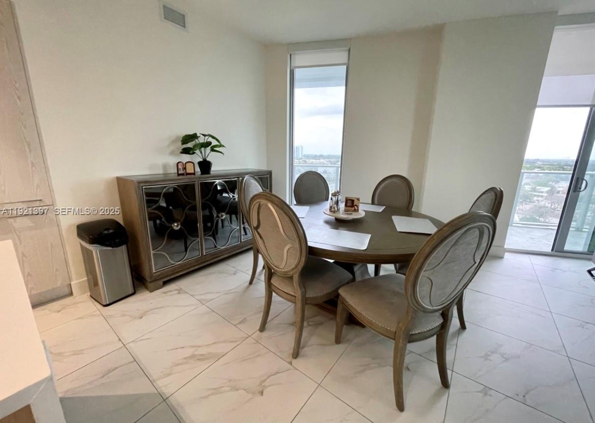 2000 Metropica Way, Unit 1009 Sunrise, FL 33323 - Photo 32 of 40 a view of a dining room with furniture
