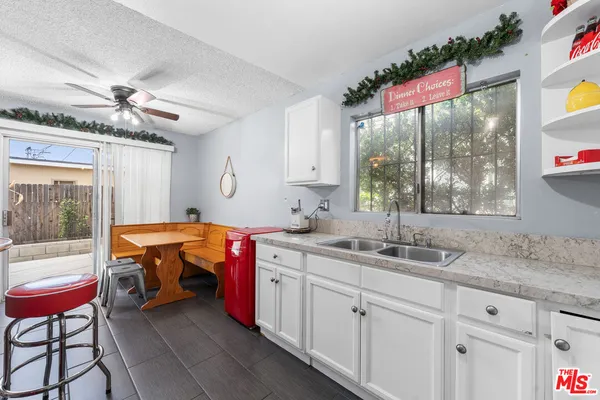 a kitchen with a sink and large window