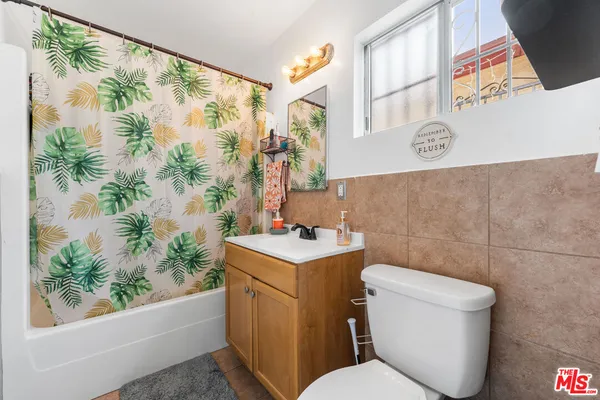 a bathroom with a toilet sink and tub
