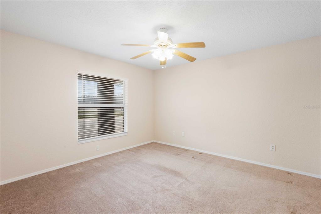 2982 Cr 756a Webster Webster, FL 33597 - Photo 24 of 26 an empty room with a window and a fan