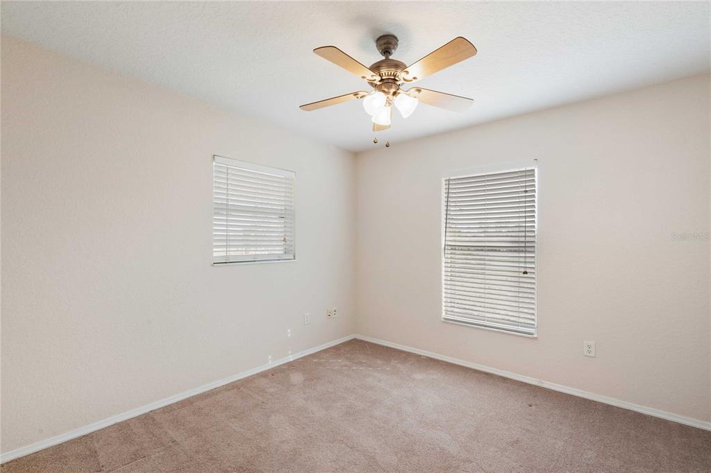 2982 Cr 756a Webster Webster, FL 33597 - Photo 5 of 26 an empty room with window and ceiling fan