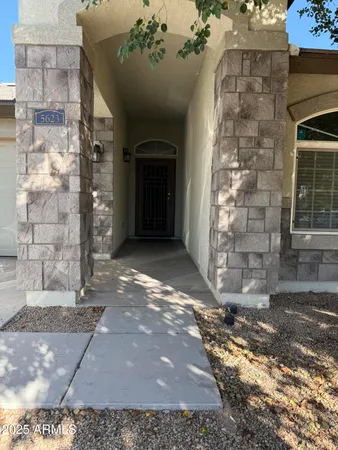 a view of a entryway door with brick walls