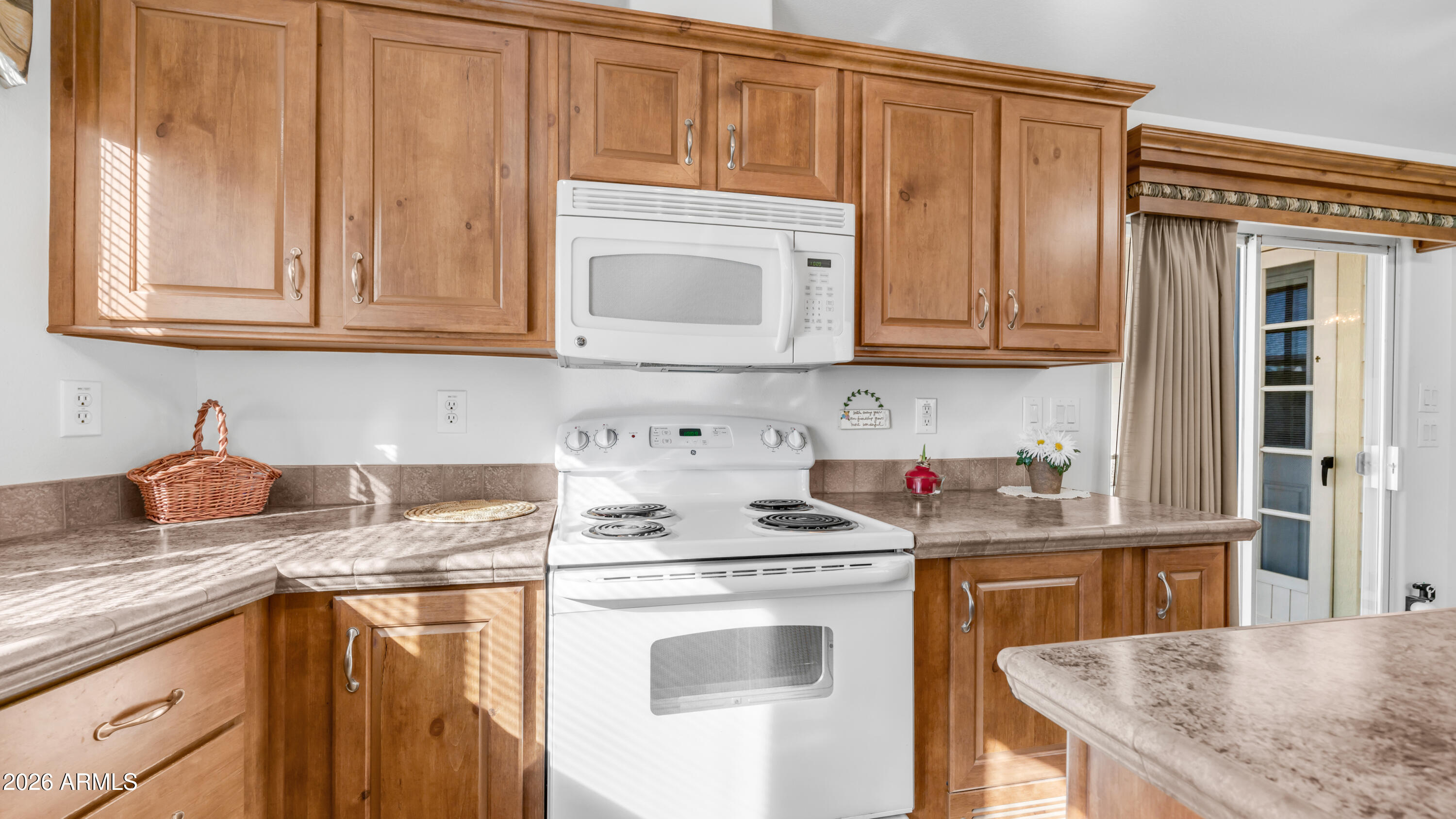 3710 South Goldfield Road, Unit 721 Apache Junction, AZ 85119 - Photo 12 of 63 a kitchen with stainless steel appliances granite countertop a sink stove and cabinets