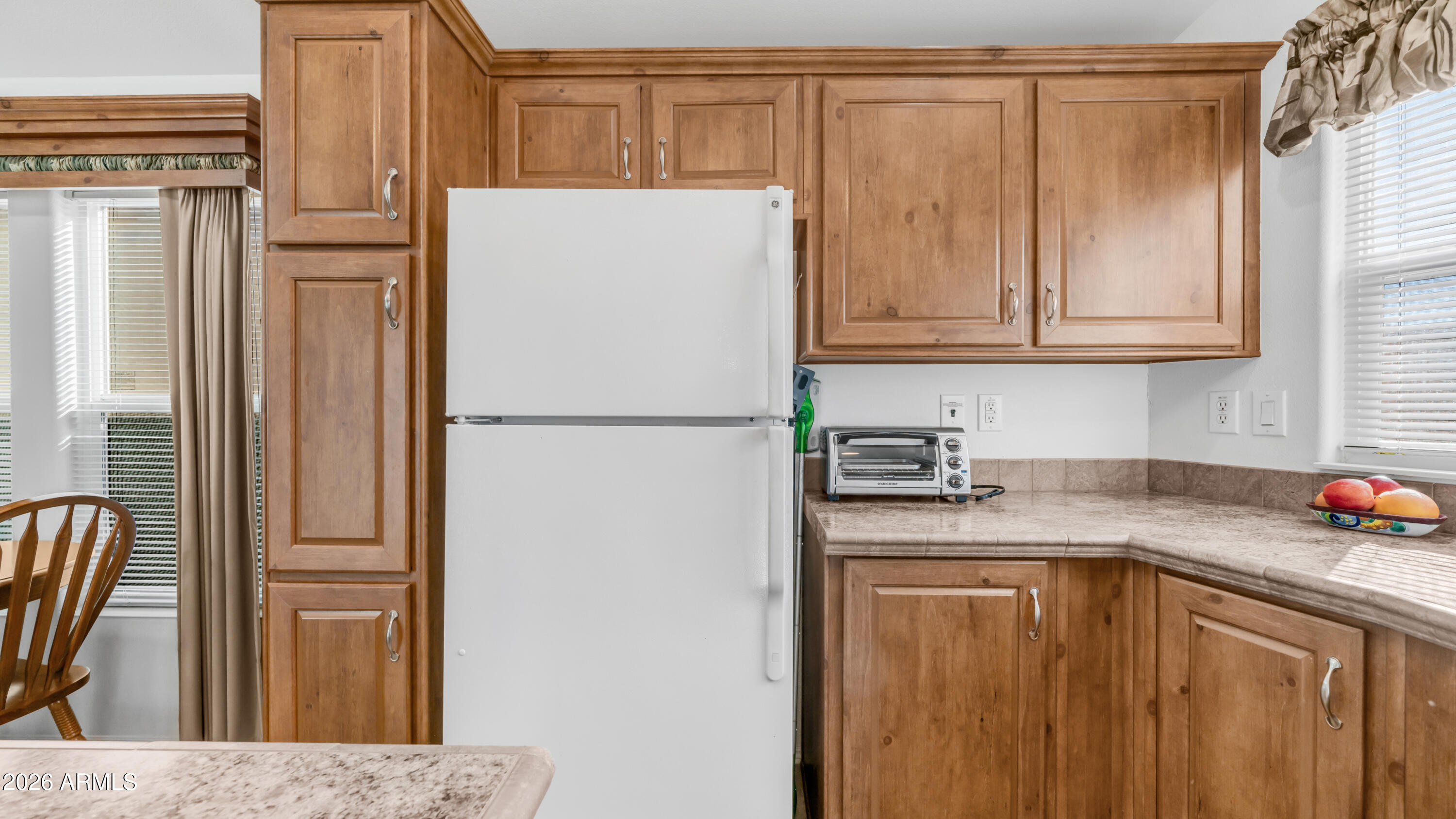 3710 South Goldfield Road, Unit 721 Apache Junction, AZ 85119 - Photo 13 of 63 a kitchen with stainless steel appliances granite countertop a refrigerator a sink and dishwasher
