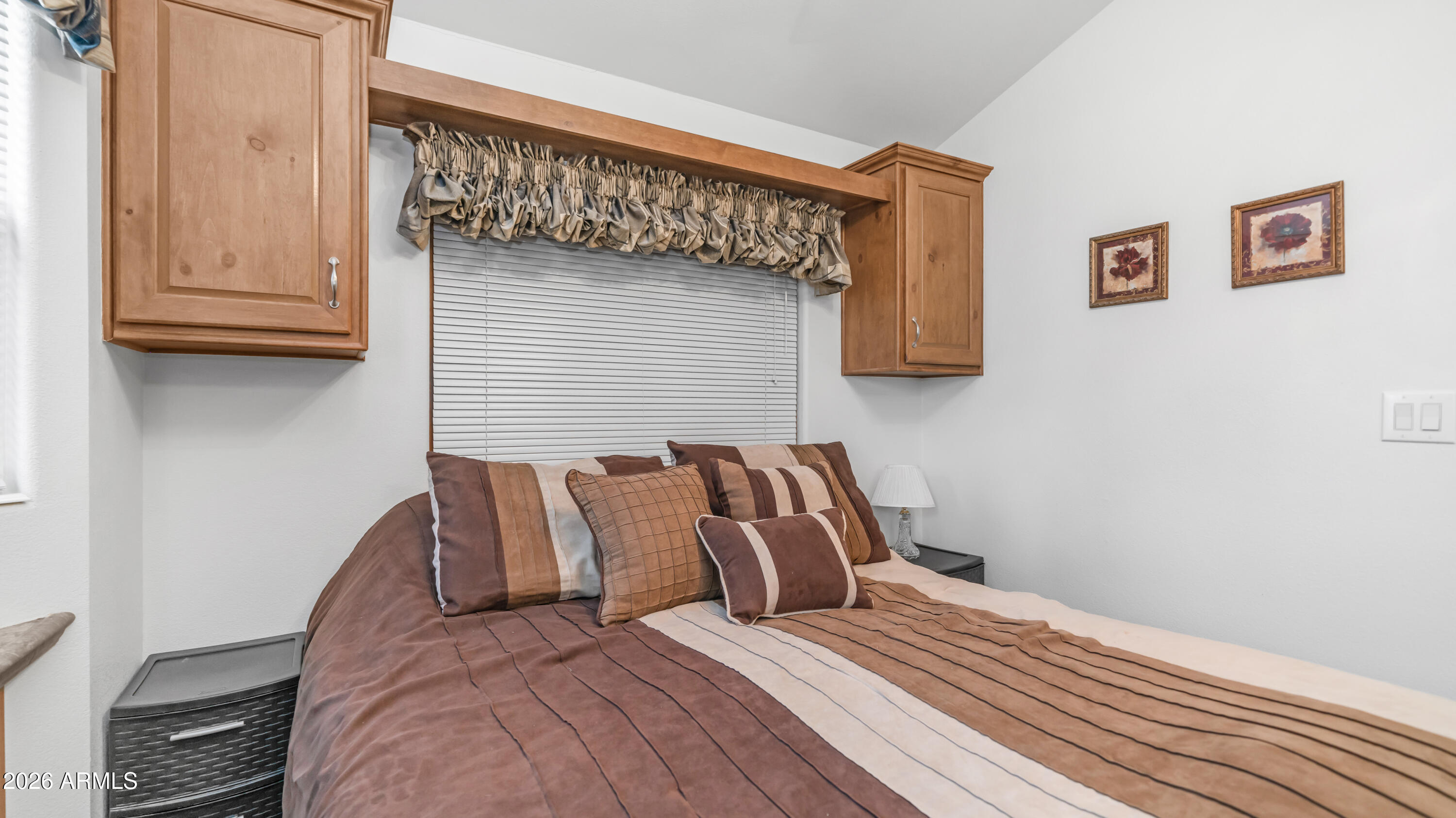 3710 South Goldfield Road, Unit 721 Apache Junction, AZ 85119 - Photo 16 of 63 a bedroom with a bed and wooden floor