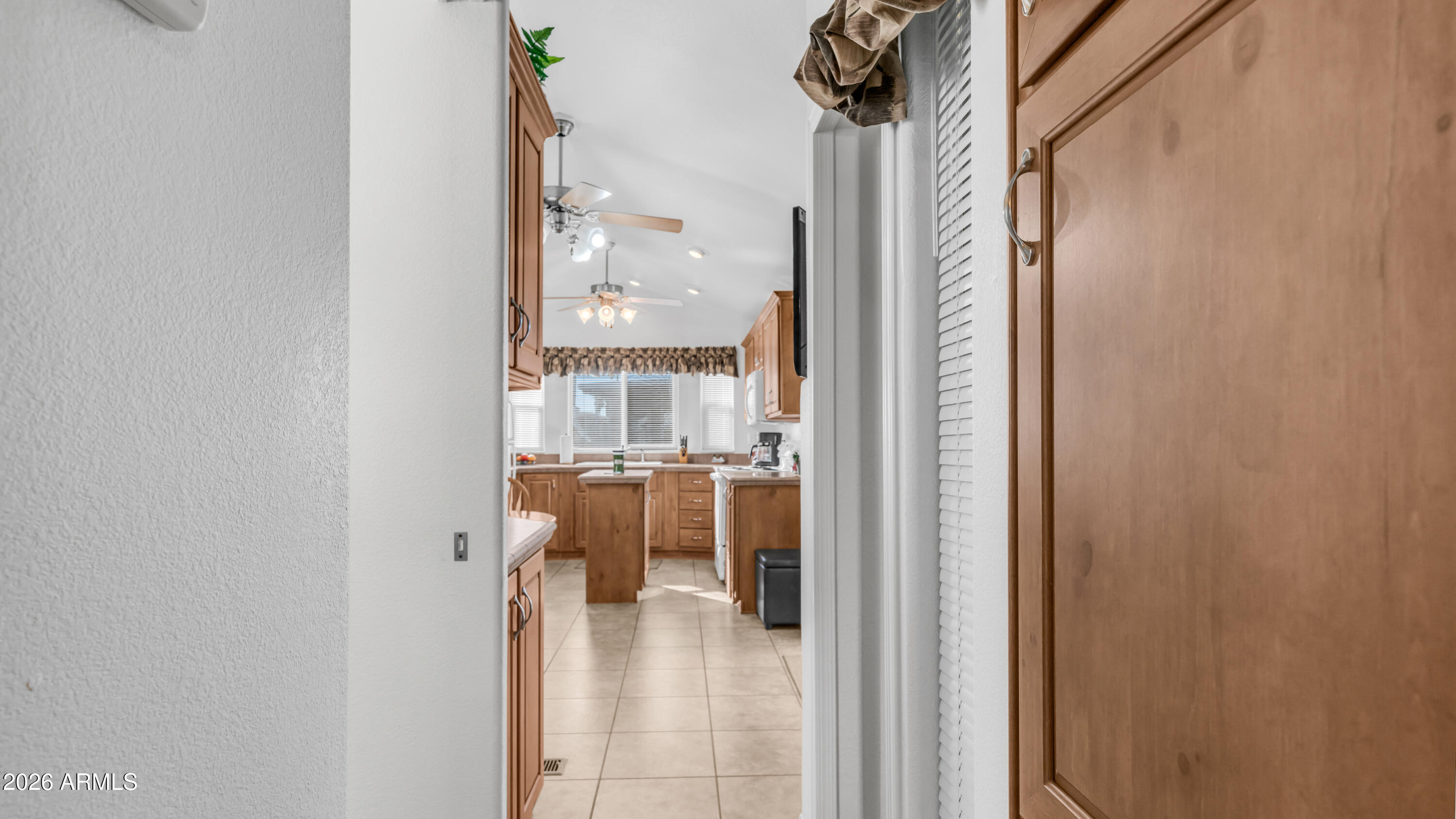 3710 South Goldfield Road, Unit 721 Apache Junction, AZ 85119 - Photo 17 of 63 a view of living room with a large window and wooden floor