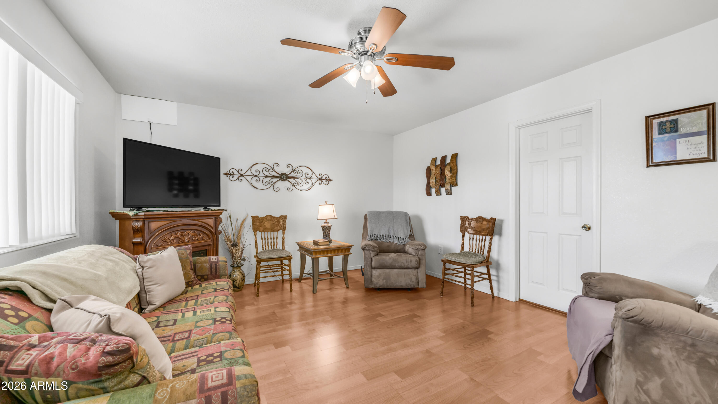 3710 South Goldfield Road, Unit 721 Apache Junction, AZ 85119 - Photo 20 of 63 a living room with furniture and a flat screen tv