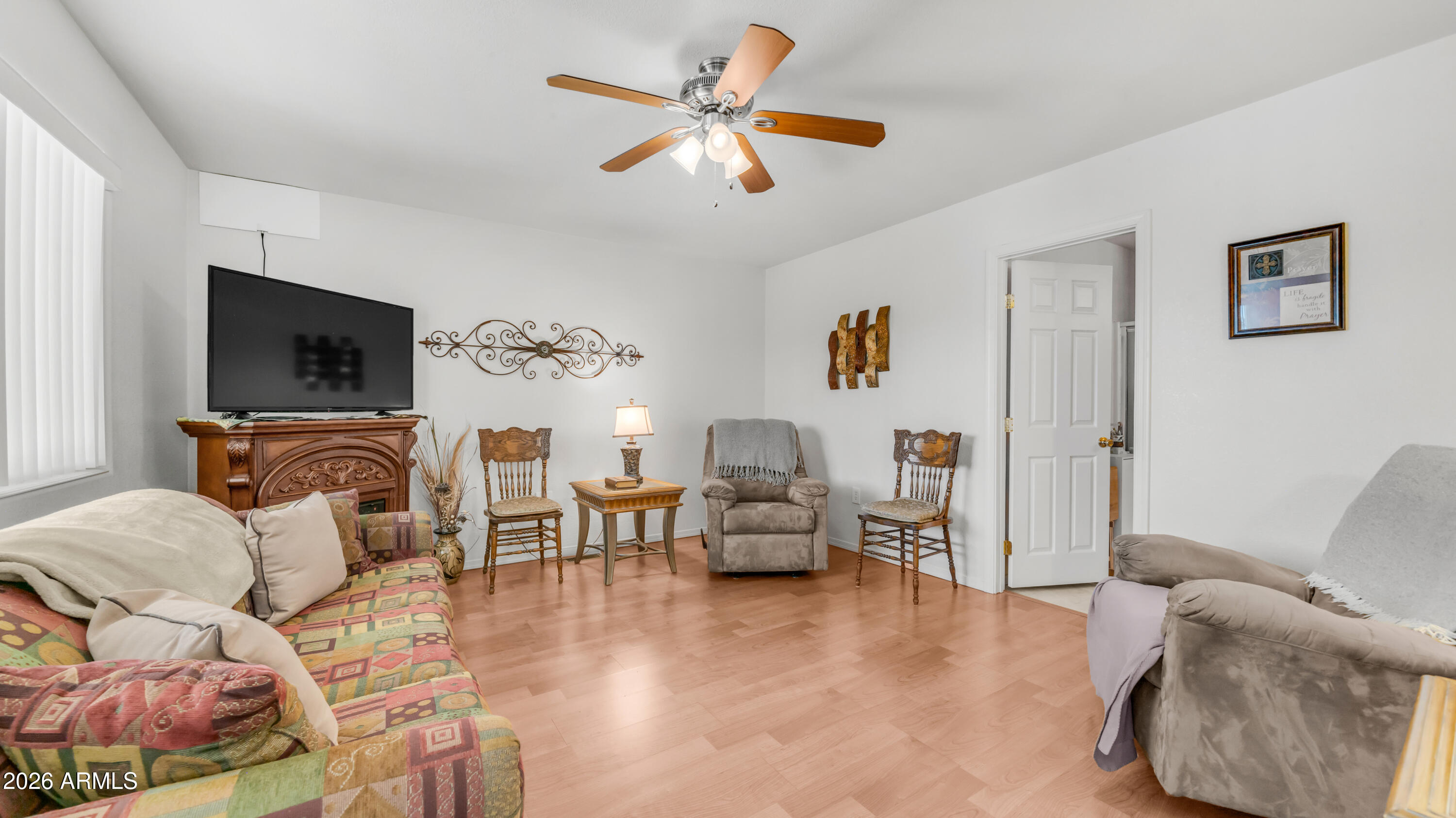 3710 South Goldfield Road, Unit 721 Apache Junction, AZ 85119 - Photo 21 of 63 a living room with furniture and a flat screen tv
