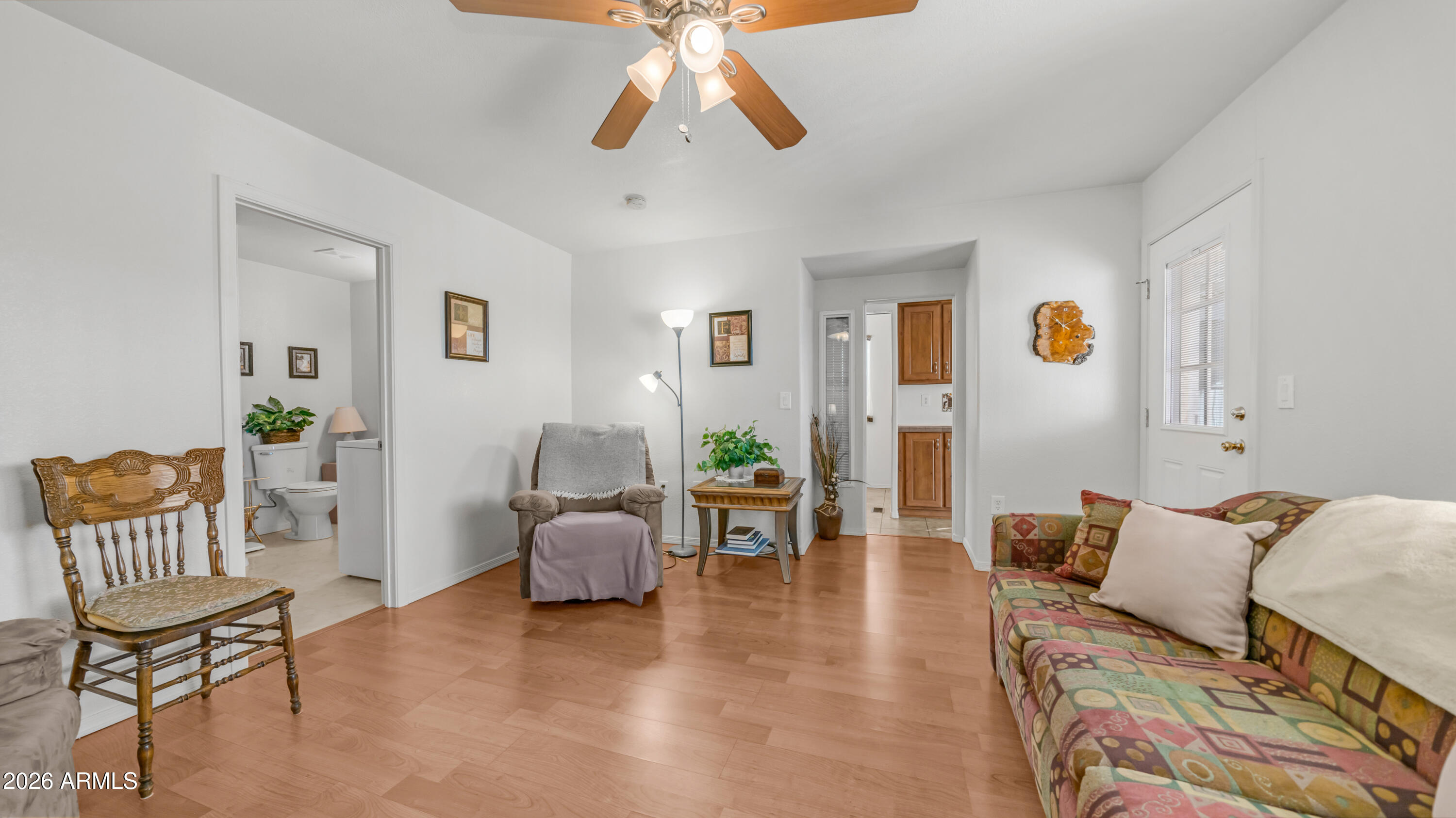 3710 South Goldfield Road, Unit 721 Apache Junction, AZ 85119 - Photo 23 of 63 a living room with furniture and wooden floor