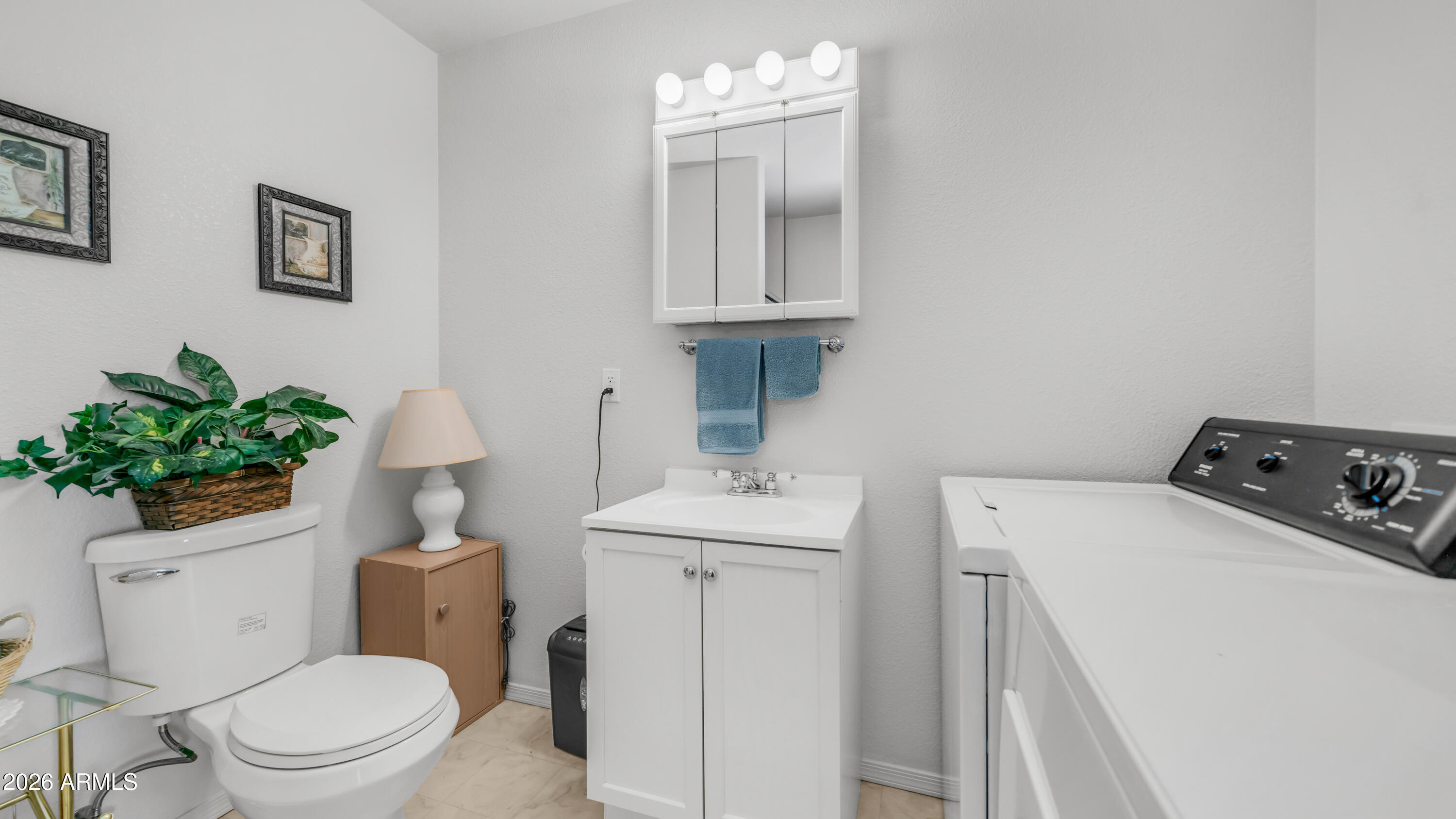 3710 South Goldfield Road, Unit 721 Apache Junction, AZ 85119 - Photo 26 of 63 a bathroom with a sink toilet and a mirror