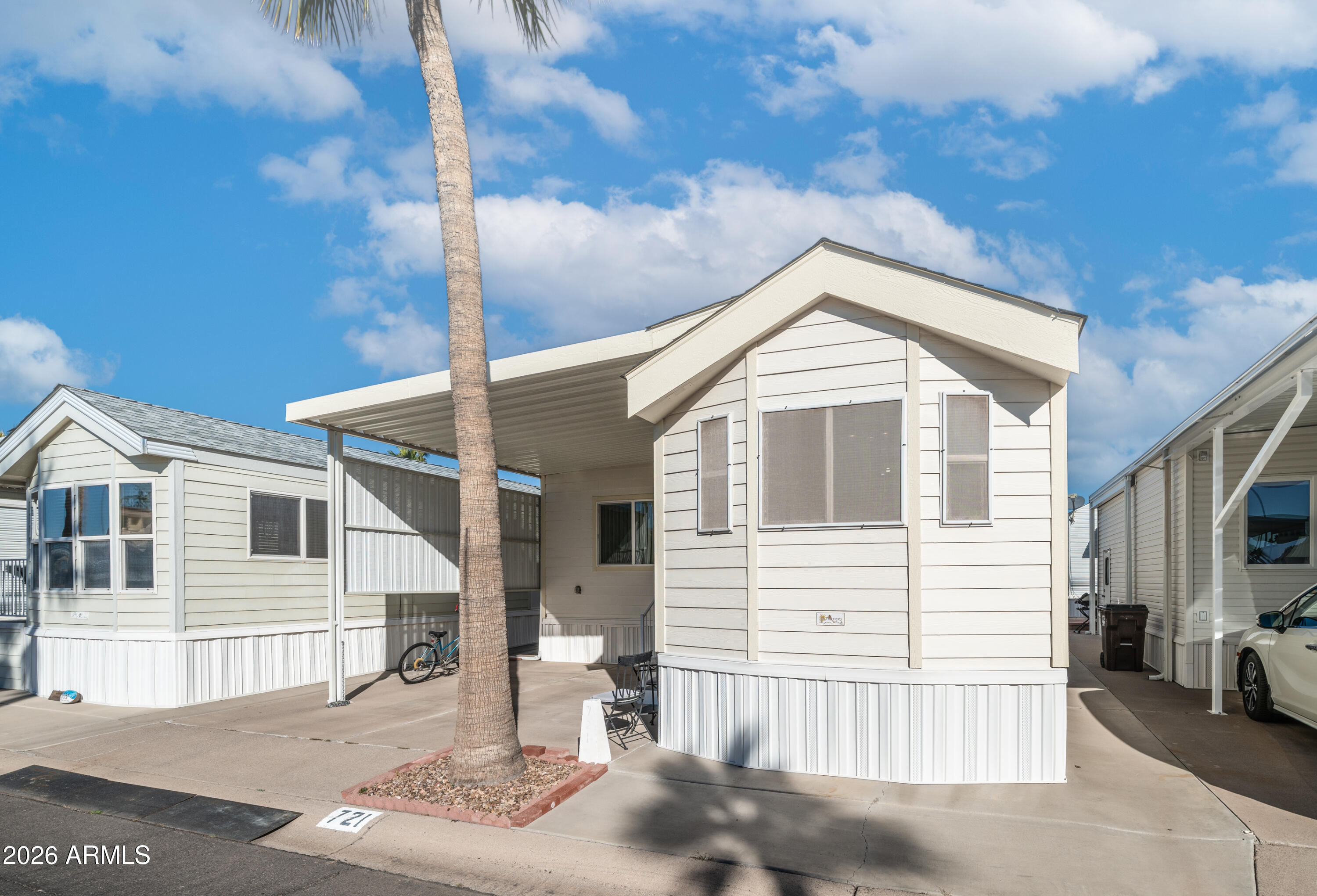 3710 South Goldfield Road, Unit 721 Apache Junction, AZ 85119 - Photo 4 of 63 a front view of a house with a garage