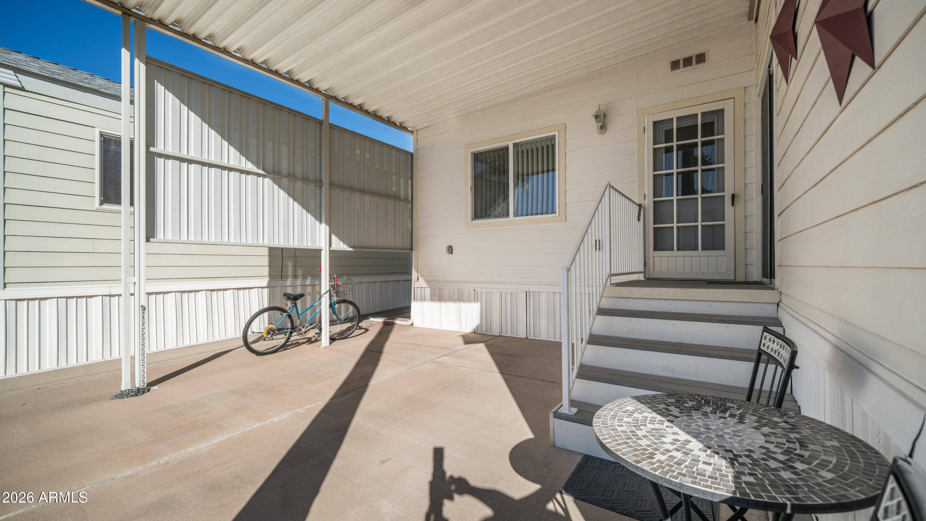 3710 South Goldfield Road, Unit 721 Apache Junction, AZ 85119 - Photo 5 of 63 a view of a chair and table in the house