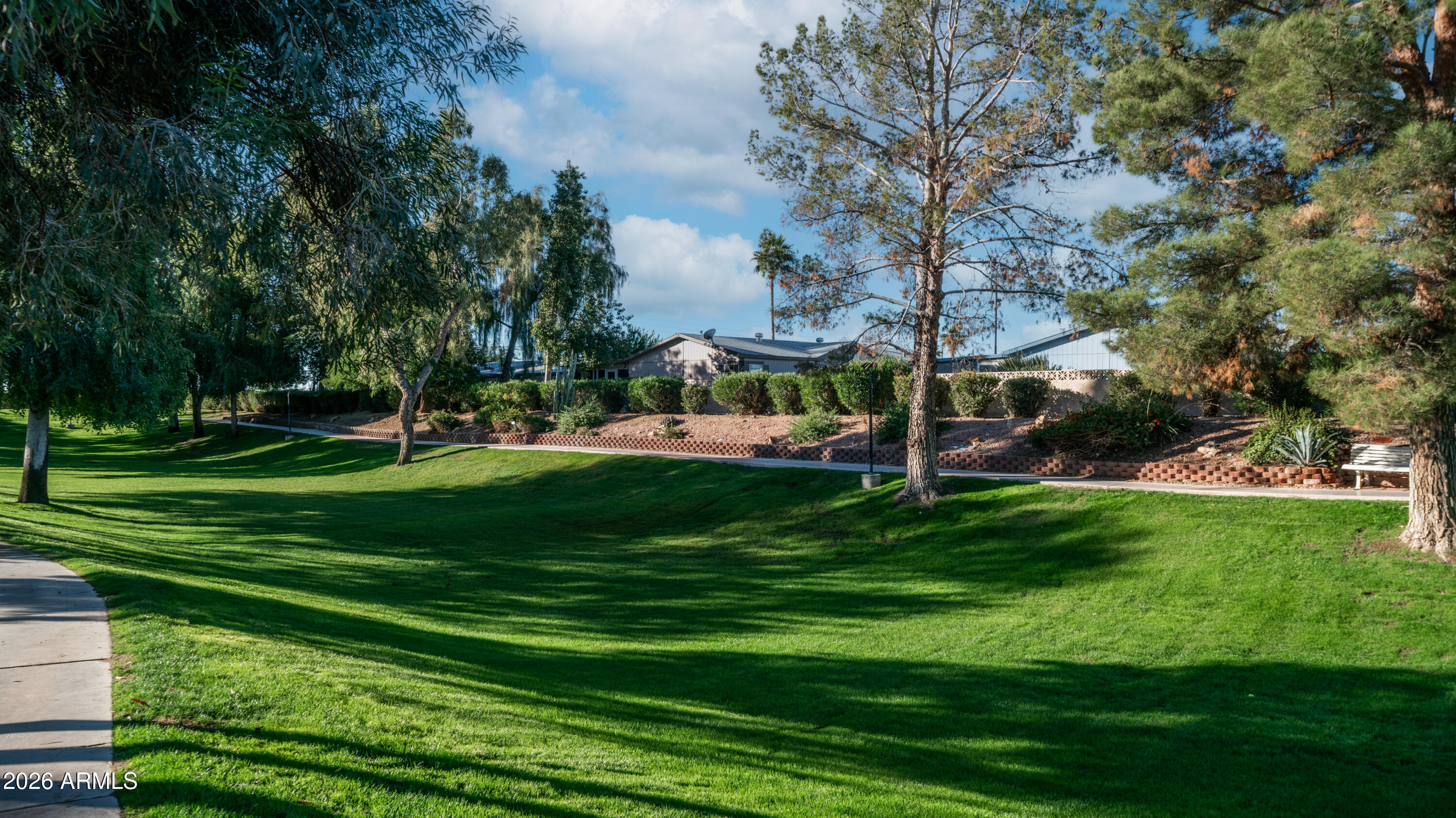 3710 South Goldfield Road, Unit 721 Apache Junction, AZ 85119 - Photo 60 of 63 a view of a park with houses