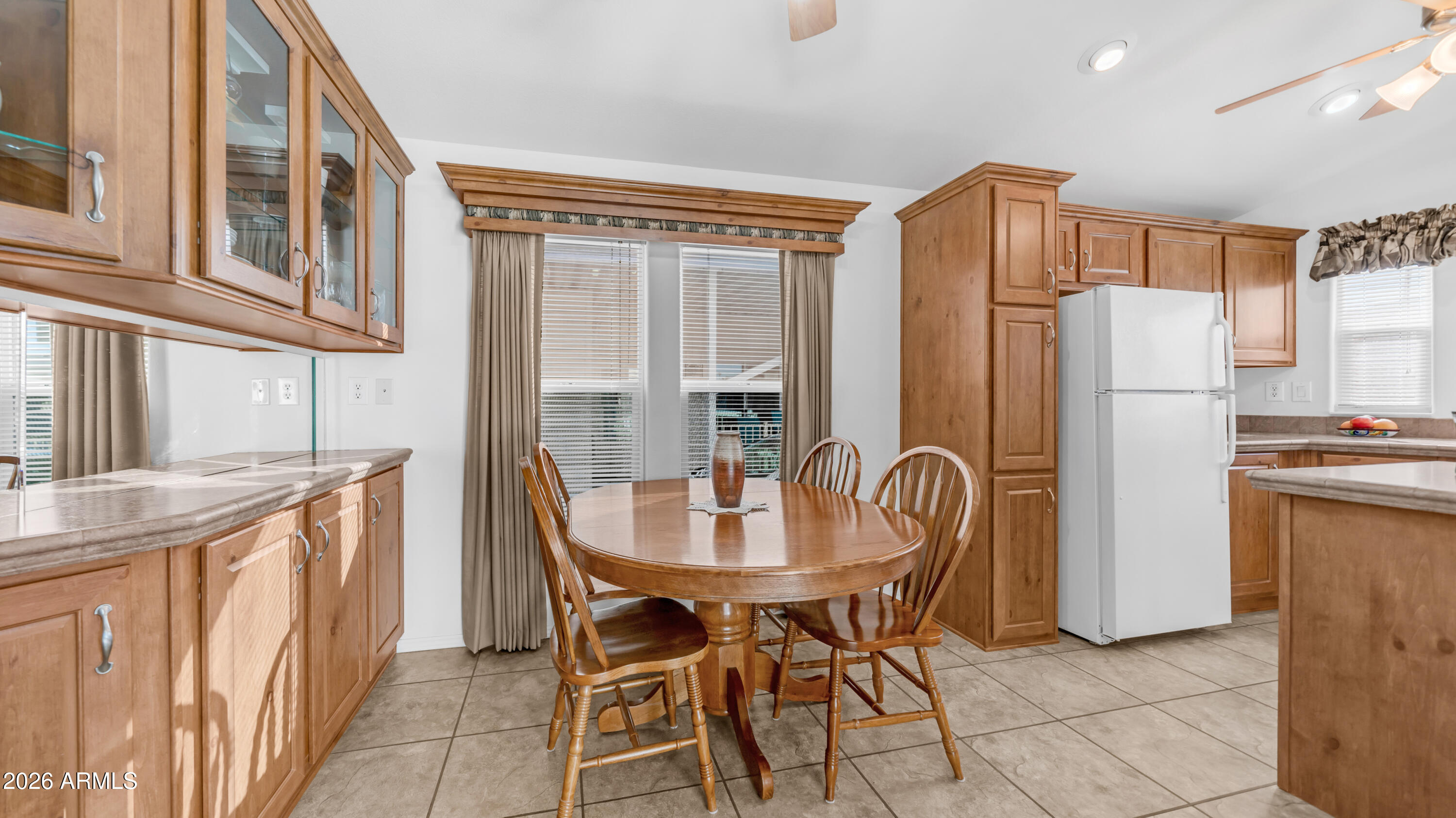 3710 South Goldfield Road, Unit 721 Apache Junction, AZ 85119 - Photo 7 of 63 a dining table chair next to a window