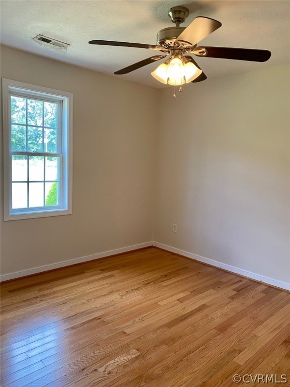 684 Bowlers Road Center Cross, VA 22437 - Photo 17 of 25 Bedroom with lovely hardwood floors & ceiling fan.