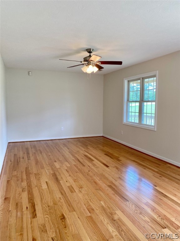 684 Bowlers Road Center Cross, VA 22437 - Photo 3 of 25 Living Room has lovely hardwood floors & ceiling f