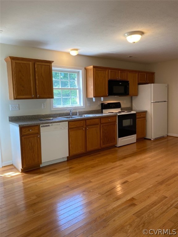 684 Bowlers Road Center Cross, VA 22437 - Photo 5 of 25 Roomy Kitchen with dining area and beautiful hardw