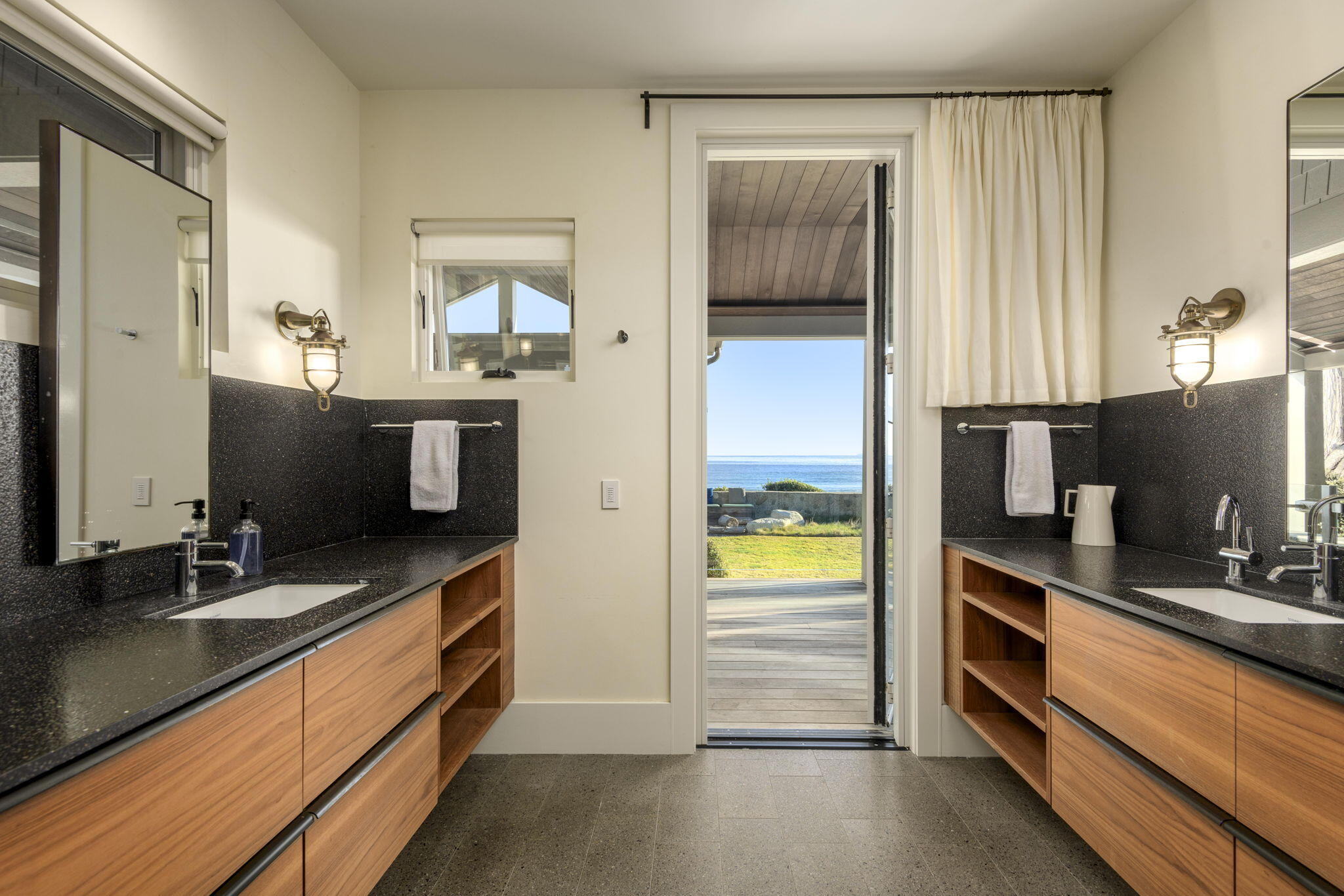 8096 Puesta Del Sol Carpinteria, CA 93013 - Photo 19 of 38 a bathroom with a double vanity sink and a mirror