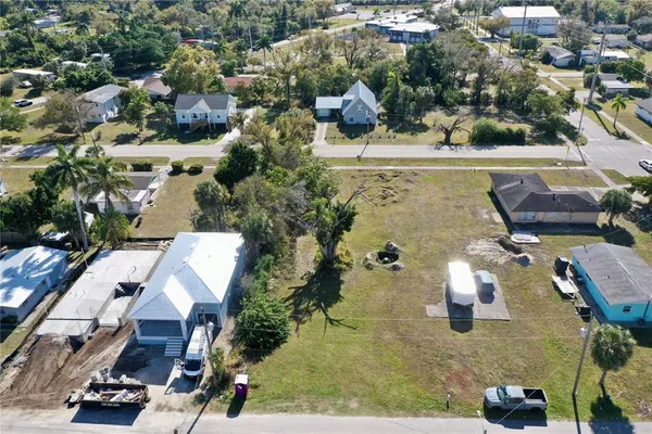an aerial view of a house with a yard