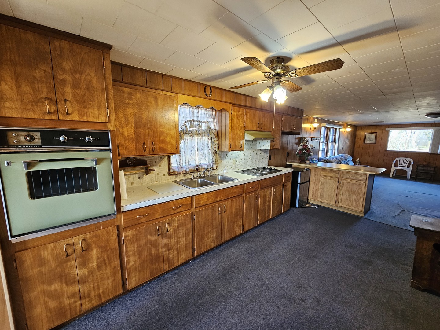 607 South Broadway Street Waltonville, IL 62894 - Photo 13 of 23 a kitchen with stainless steel appliances granite countertop a sink and cabinets
