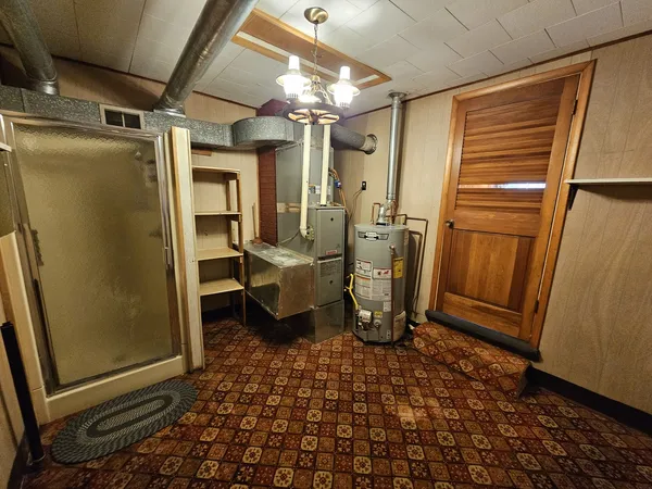 a bathroom with a sink a toilet and a shower
