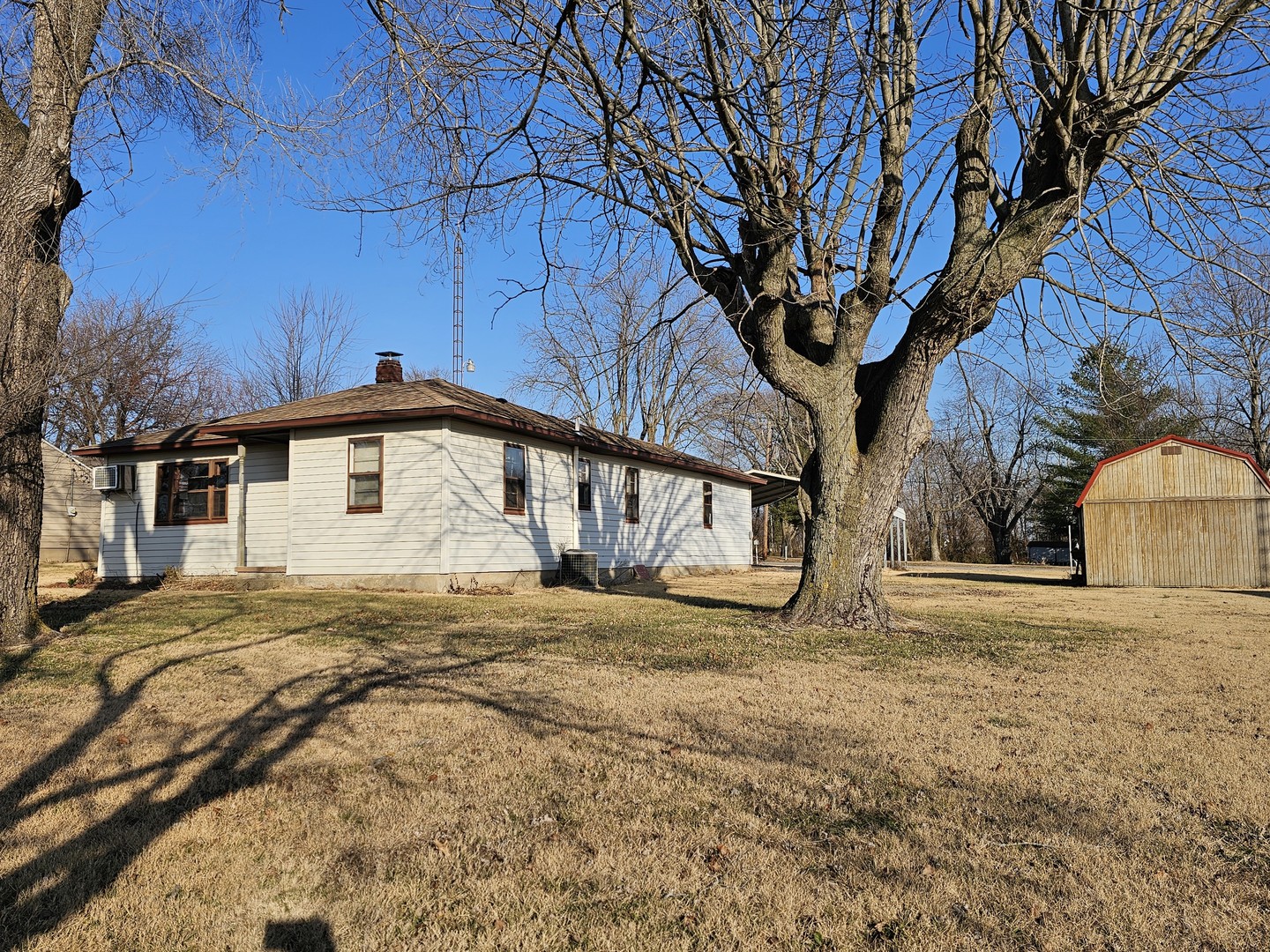 607 South Broadway Street Waltonville, IL 62894 - Photo 6 of 23 a house with trees in front of it