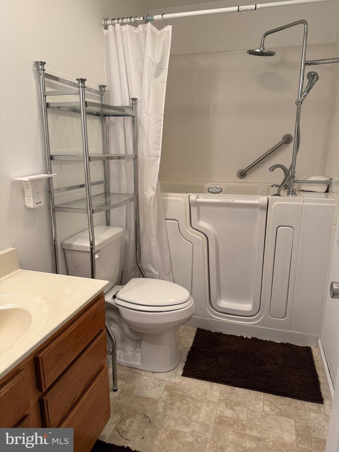 722 Oak Hill Road Berkeley Springs, WV 25411 - Photo 7 of 16 a bathroom with a toilet a sink and shower