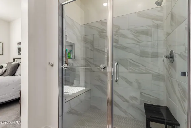 a bathroom with a bathtub and shower