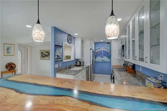 a view of a living room and chandelier