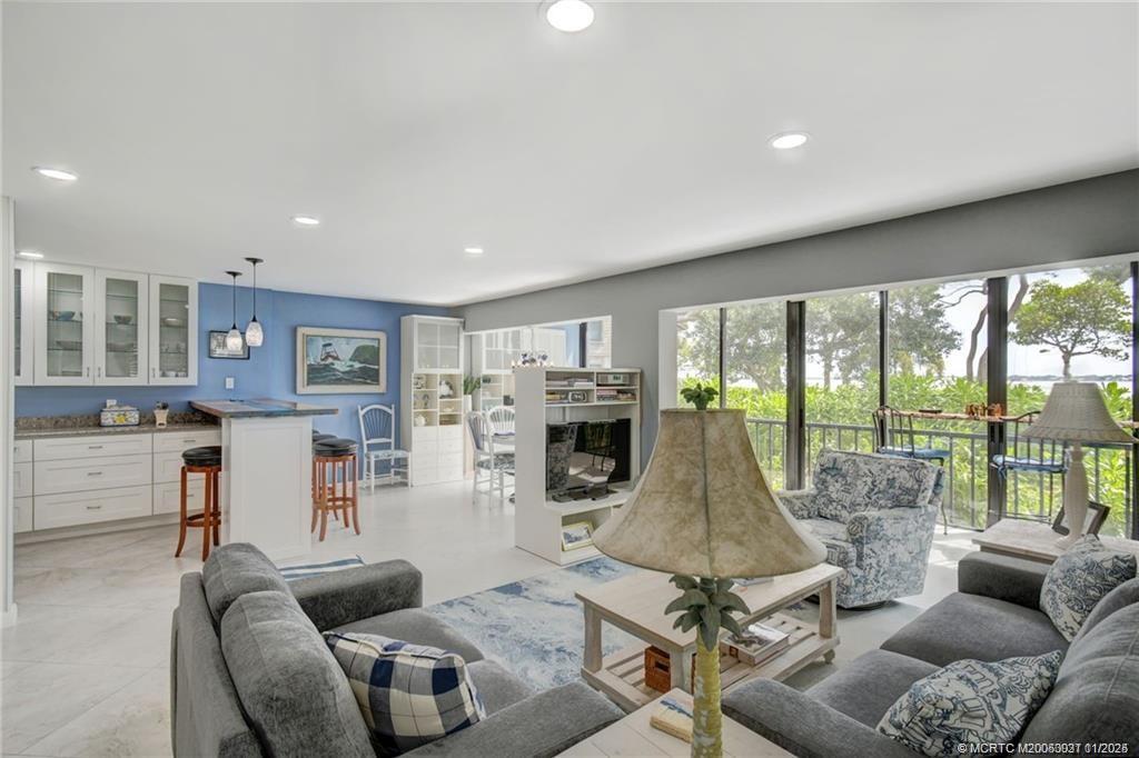 248 Northeast Edgewater Drive Stuart, FL 34996 - Photo 15 of 38 a living room with furniture large window and outer view