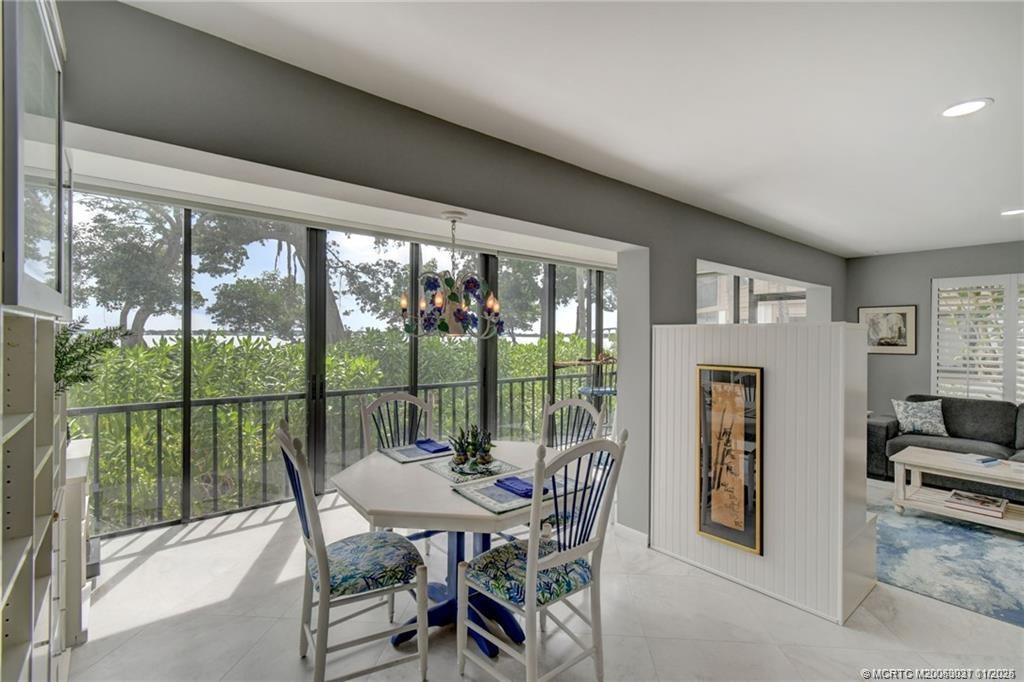 248 Northeast Edgewater Drive Stuart, FL 34996 - Photo 19 of 38 a view of a dining room with furniture window and outside view