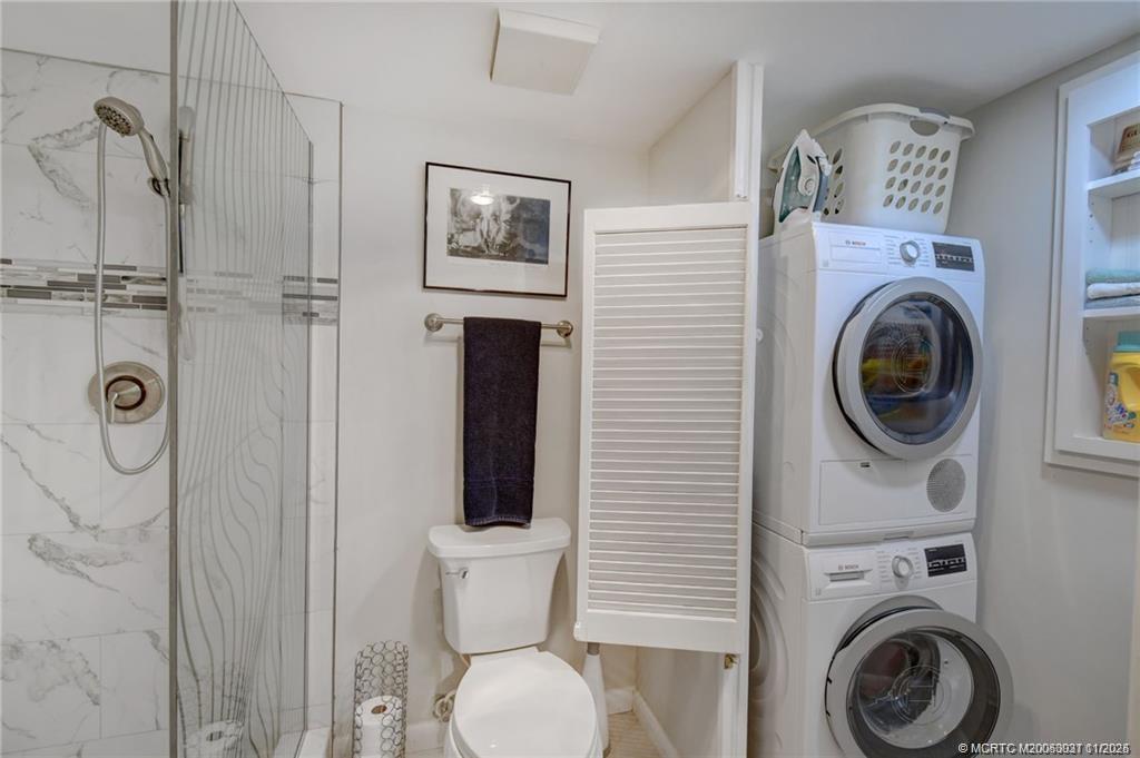 248 Northeast Edgewater Drive Stuart, FL 34996 - Photo 30 of 38 a view of a hallway with washer and dryer