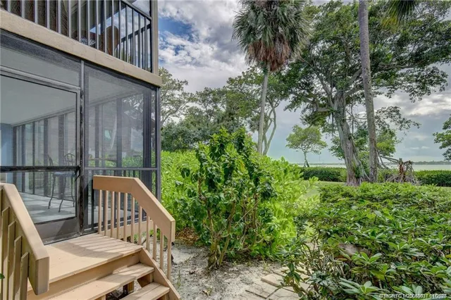a view of balcony with wooden floor and outdoor seating