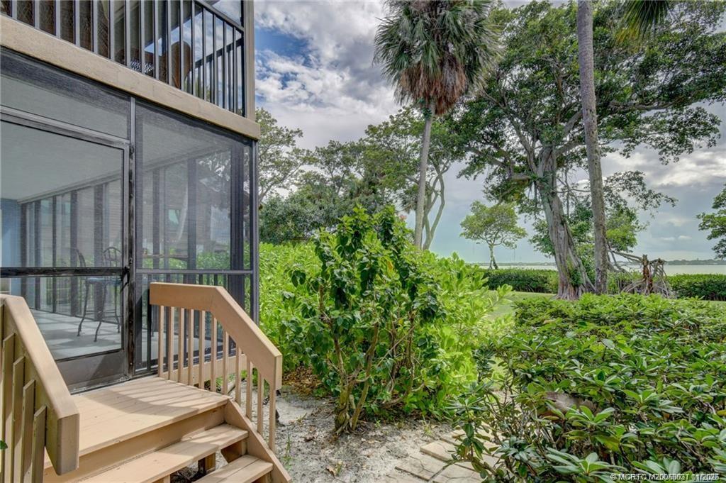 248 Northeast Edgewater Drive Stuart, FL 34996 - Photo 3 of 38 a view of balcony with wooden floor and outdoor seating