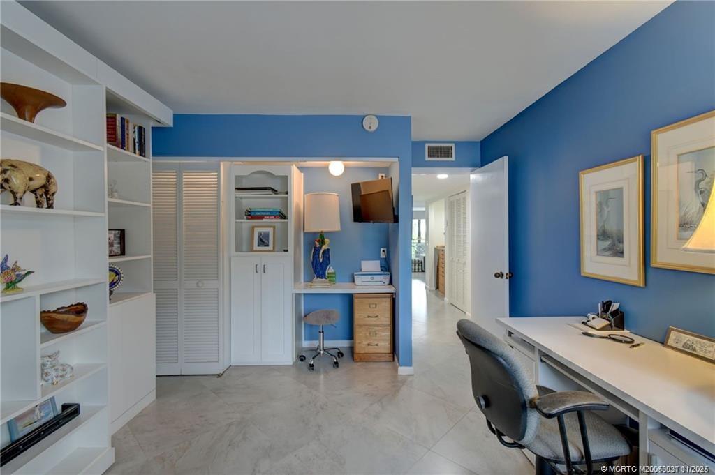 248 Northeast Edgewater Drive Stuart, FL 34996 - Photo 32 of 38 a view of kitchen with stainless steel appliances refrigerator stove and cabinets