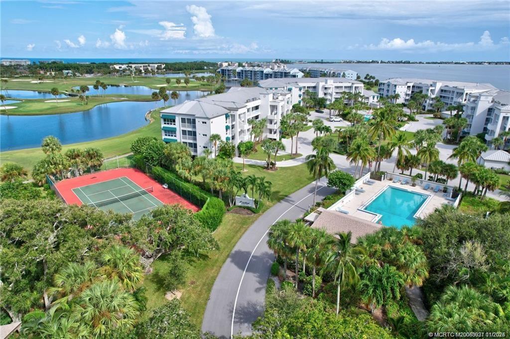 248 Northeast Edgewater Drive Stuart, FL 34996 - Photo 35 of 38 a view of a lake with a building in the back