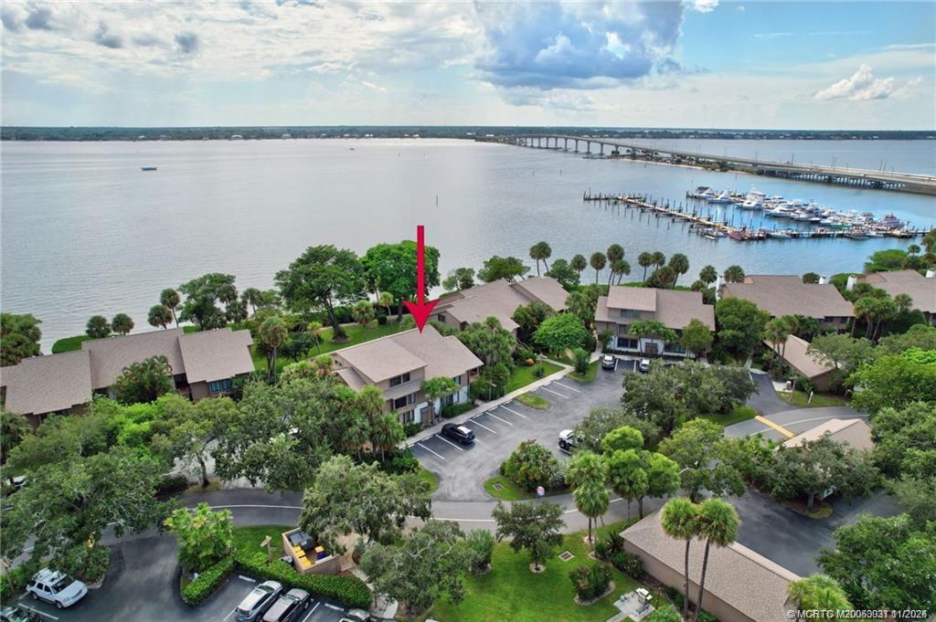 248 Northeast Edgewater Drive Stuart, FL 34996 - Photo 5 of 38 an aerial view of a house with a yard and lake view