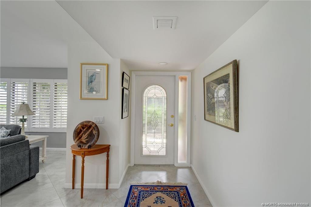 248 Northeast Edgewater Drive Stuart, FL 34996 - Photo 8 of 38 a view of a livingroom with windows