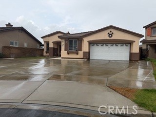 17416 Birchtree Street Fontana, CA 92337 - Photo 1 of 18 a view of a house with a yard and garage