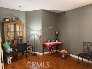 17416 Birchtree Street Fontana, CA 92337 - Photo 7 of 18 a living room with furniture and a wooden floor