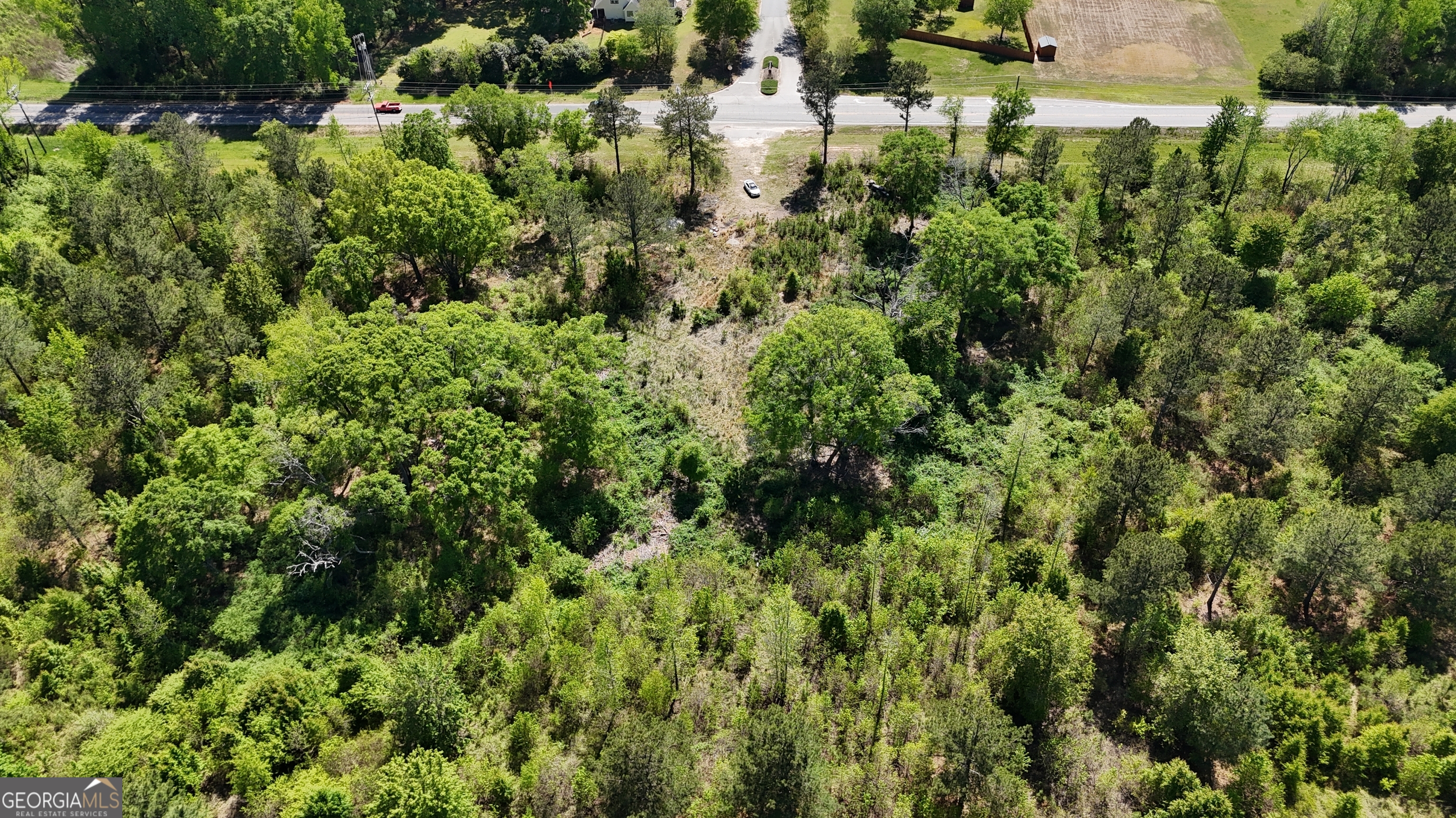 2 Highway 53 Bogart, GA 30622 - Photo 4 of 5 a view of a house with a lush green forest