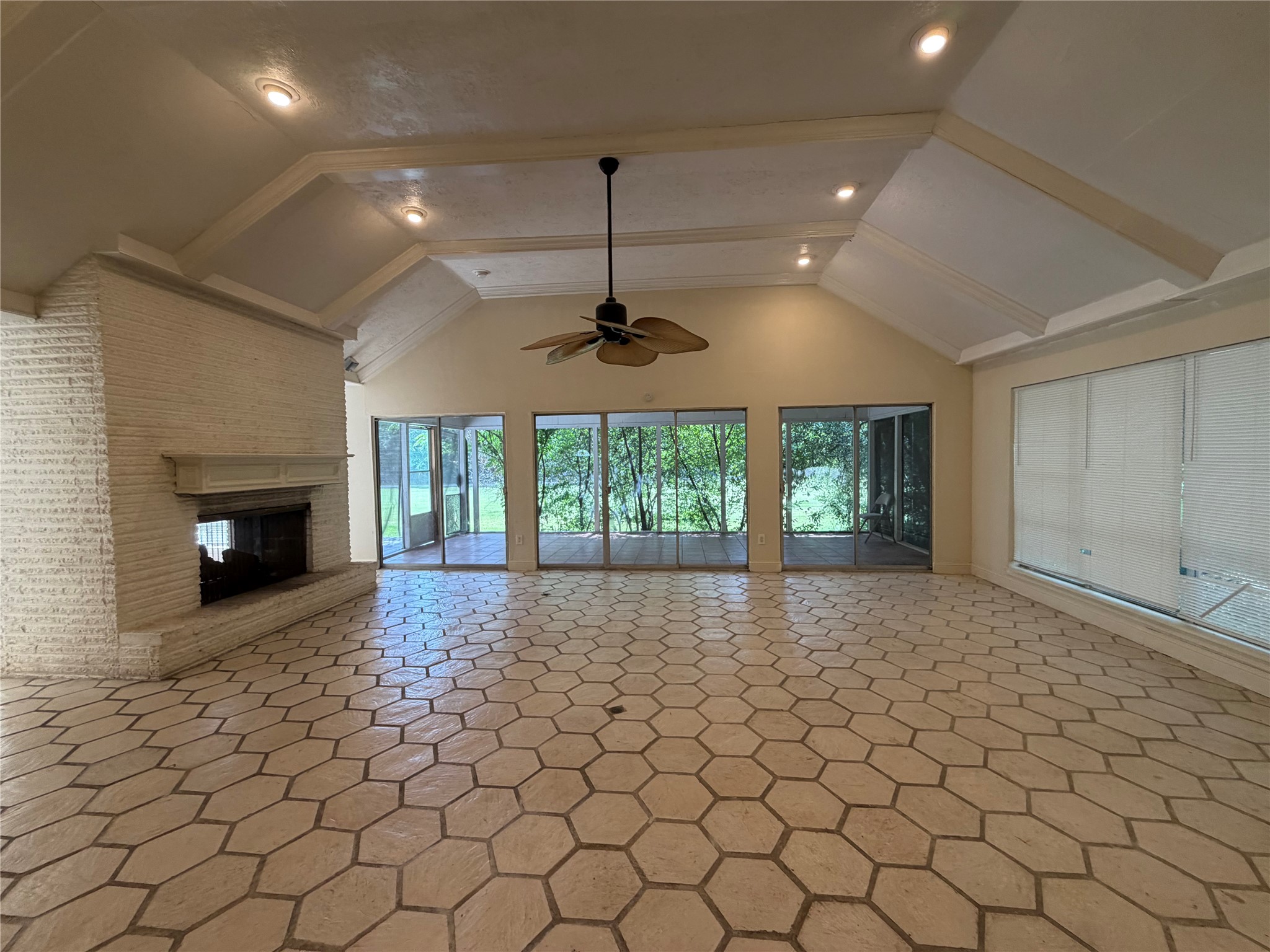 535 Brandon Road Conroe, TX 77302 - Photo 4 of 10 an empty room with windows and fireplace