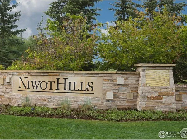 a view of outdoor space with garden and trees