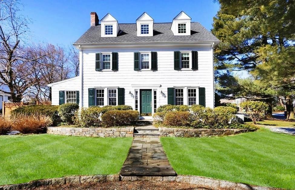 12 Dorchester Lane Riverside, CT 06878 - Photo 1 of 35 a front view of a house with a yard