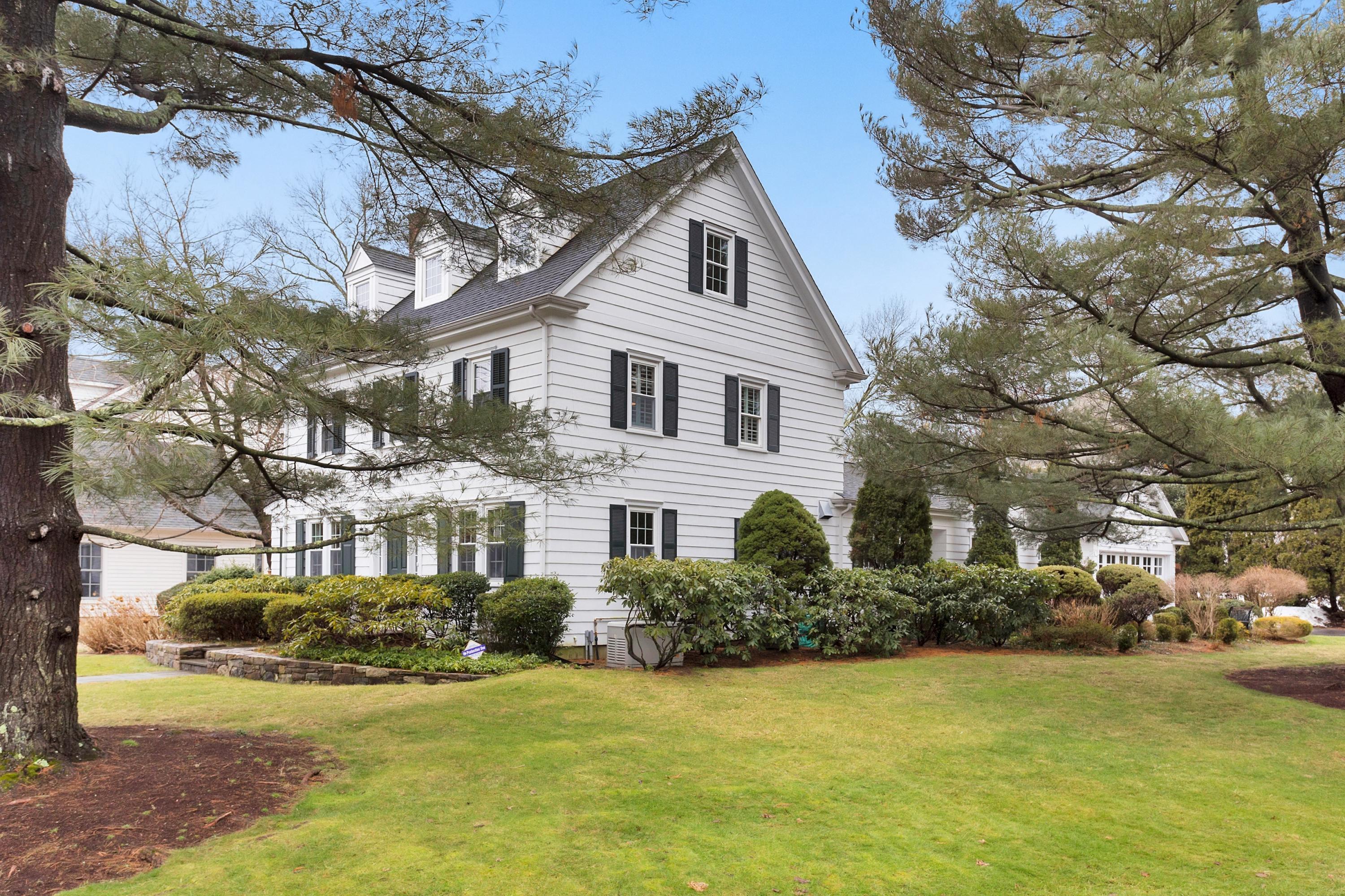 12 Dorchester Lane Riverside, CT 06878 - Photo 2 of 35 a front view of a house with a garden