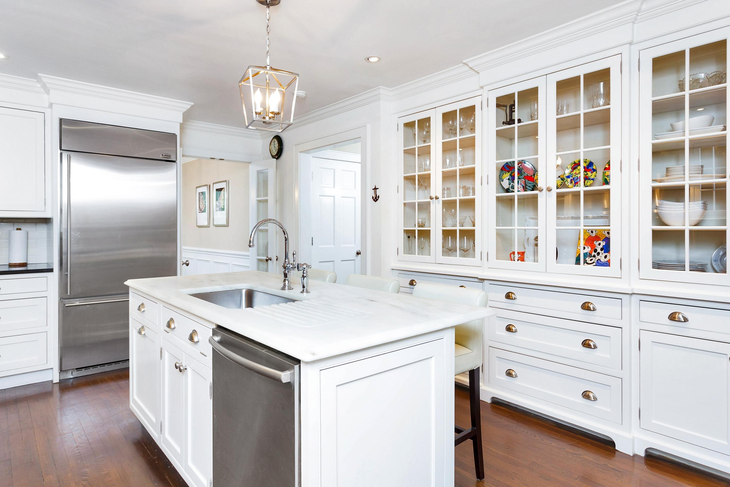 12 Dorchester Lane Riverside, CT 06878 - Photo 13 of 35 a kitchen with a sink stove and cabinets