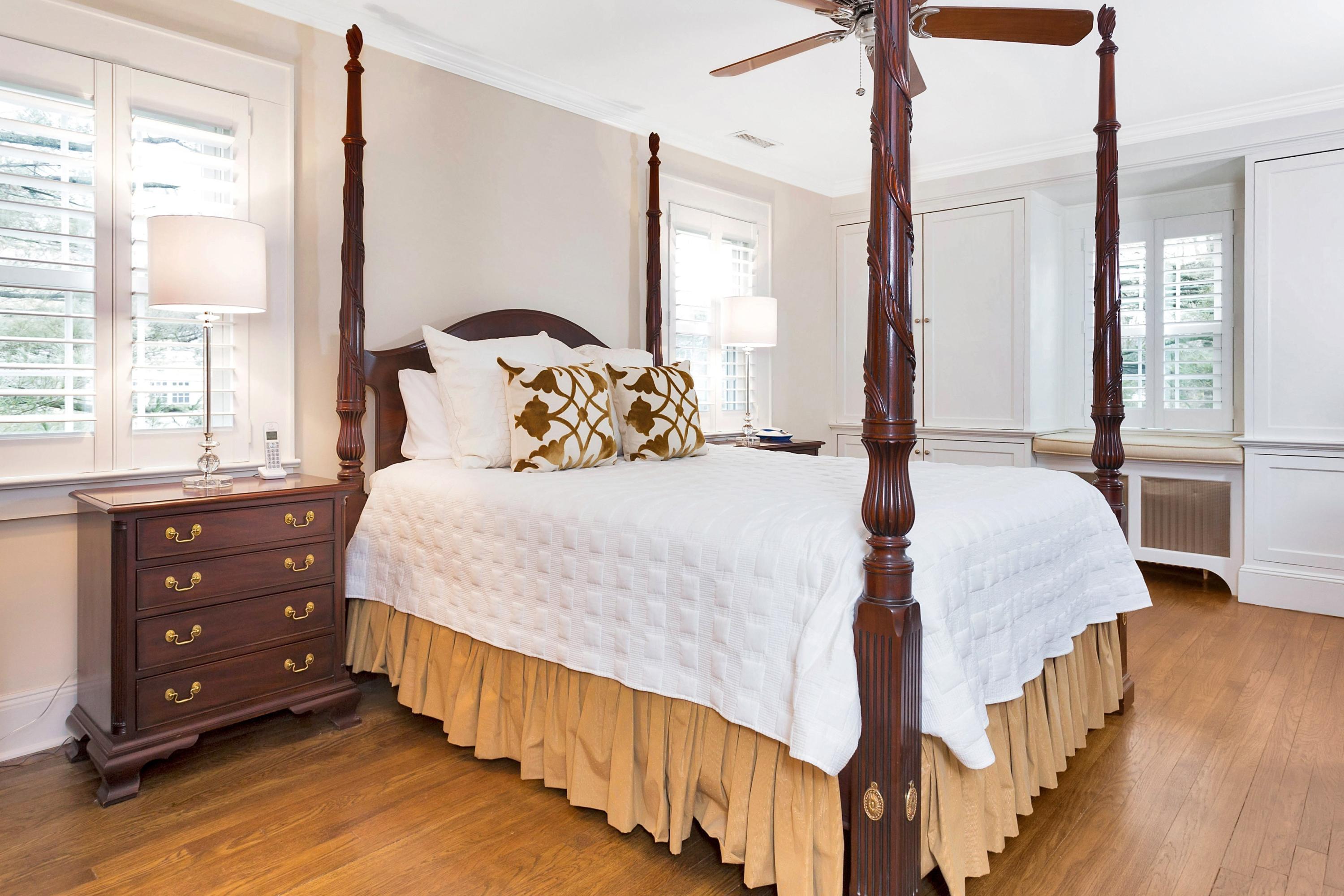 12 Dorchester Lane Riverside, CT 06878 - Photo 17 of 35 a bedroom with a bed and a dresser next to a window