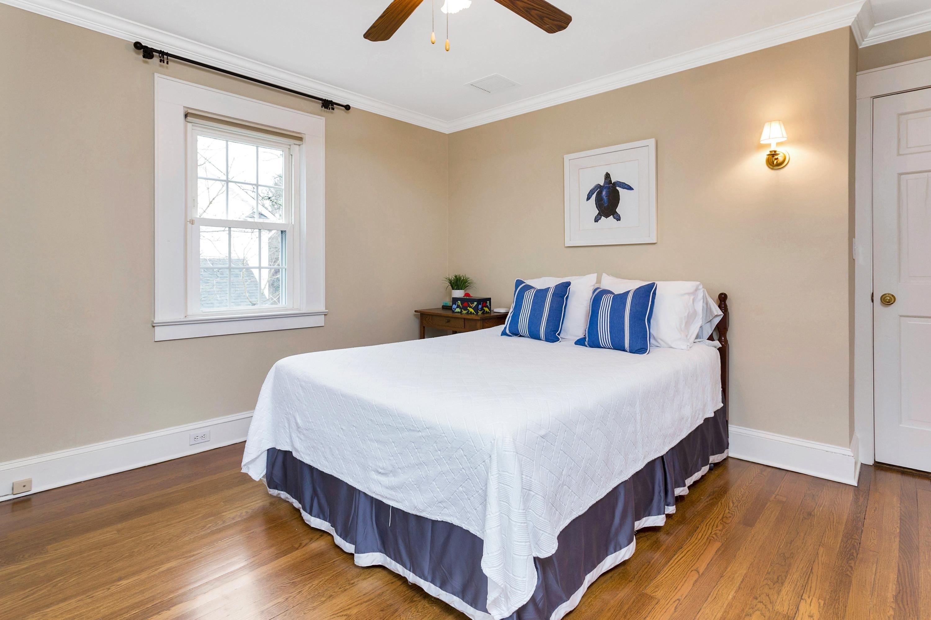 12 Dorchester Lane Riverside, CT 06878 - Photo 20 of 35 a bedroom with a bed and wooden floor